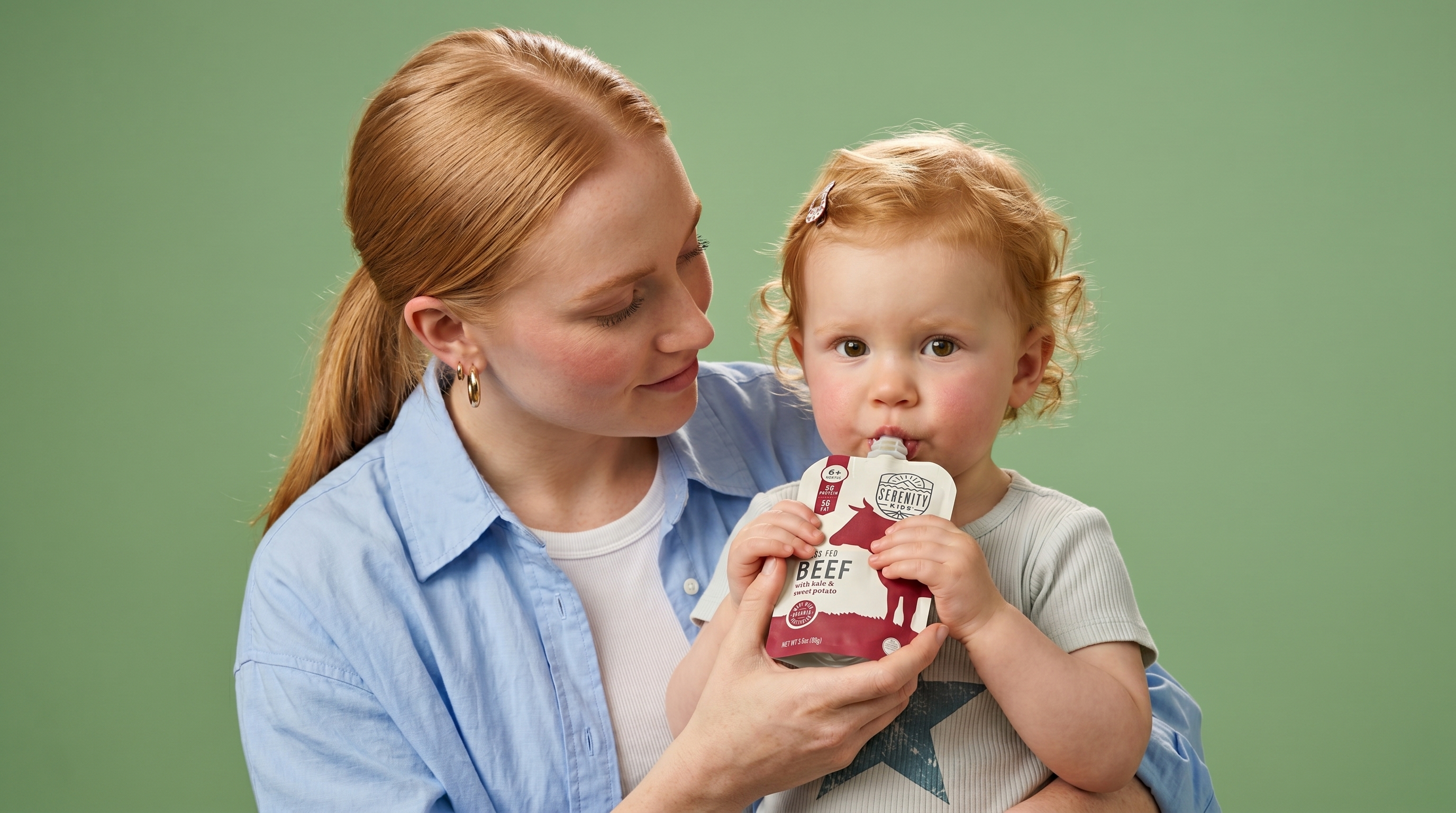 A mother looking at her toddler as the toddler holds a Serenity Kids beef pouch